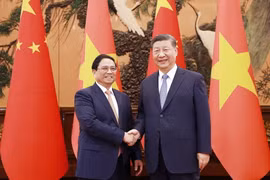 Thủ tướng Phạm Minh Chính hội kiến Tổng Bí thư, Chủ tịch Trung Quốc Tập Cận Bình. (Ảnh: Dương Giang/TTXVN)