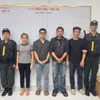 4 đối tượng (thứ 2 từ trái qua) tại cơ quan điều tra. (Ảnh: PV/Vietnam+)