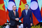 Thủ tướng Lê Minh Hưng tiếp đồng chí Vilay Lakhamphong, Thường trực Ban Bí thư Trung ương Đảng Nhân dân Cách mạng Lào. (Ảnh: Dương Giang/TTXVN)